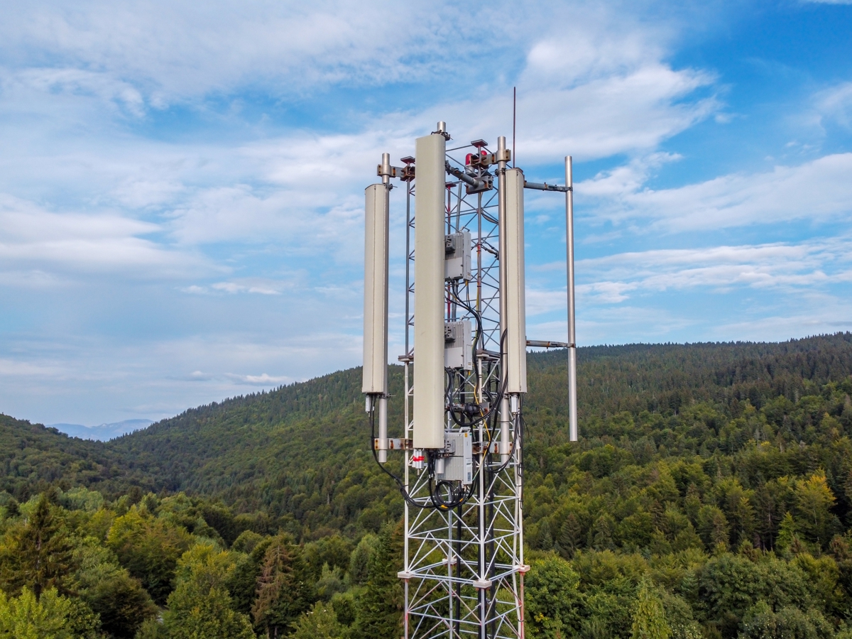 A tower broadcasting fixed wireless internet access in a rural area.